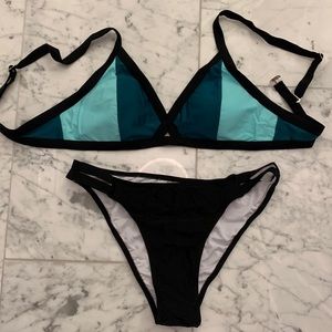 Color block green and bikini top with black cheeky bottoms